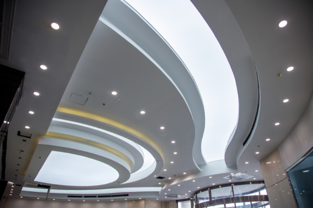 Modern false ceiling design with LED lighting by El Shadai Constructions